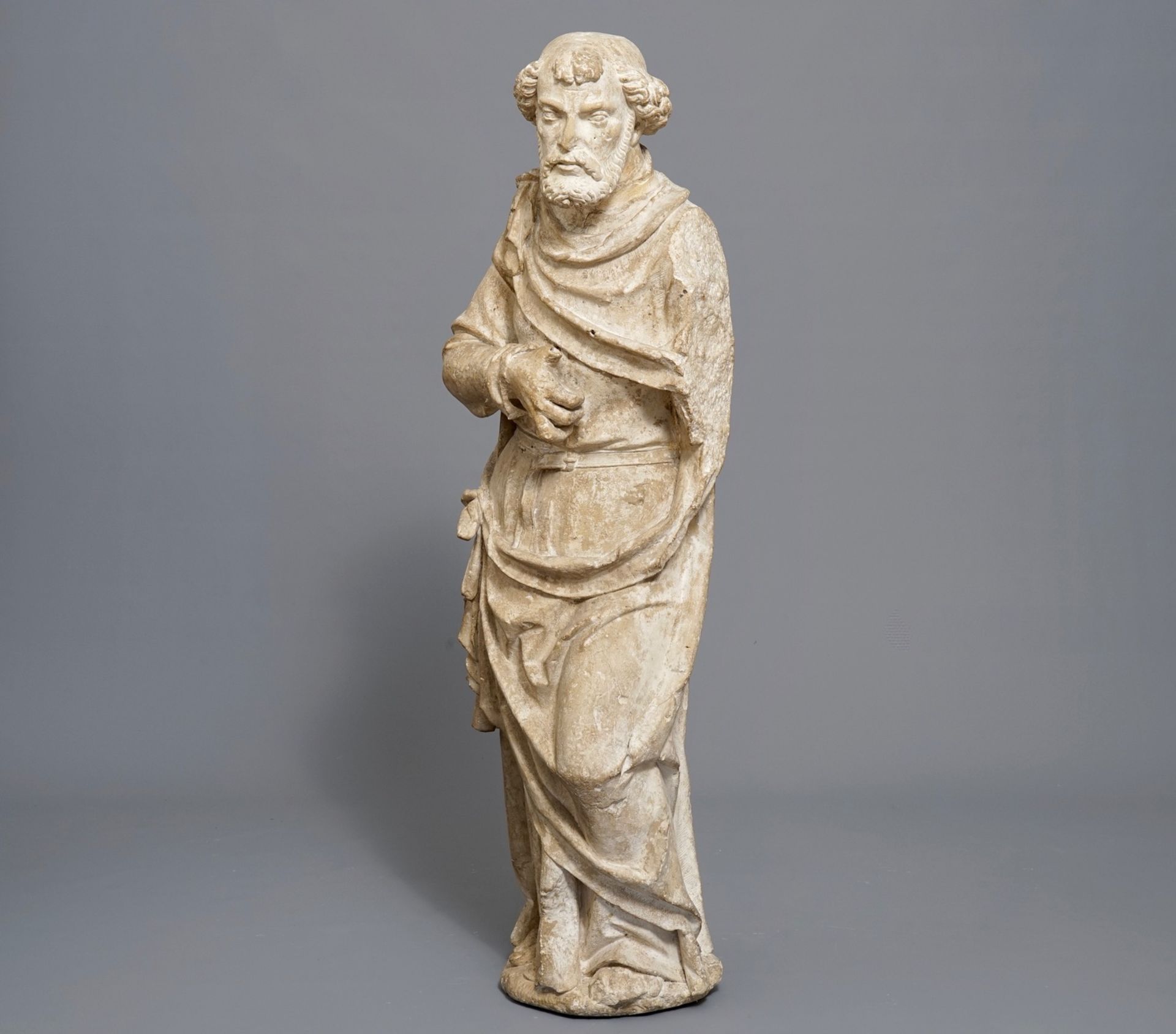 A carved stone figure of Saint Peter standing, prob. France, 16th C.