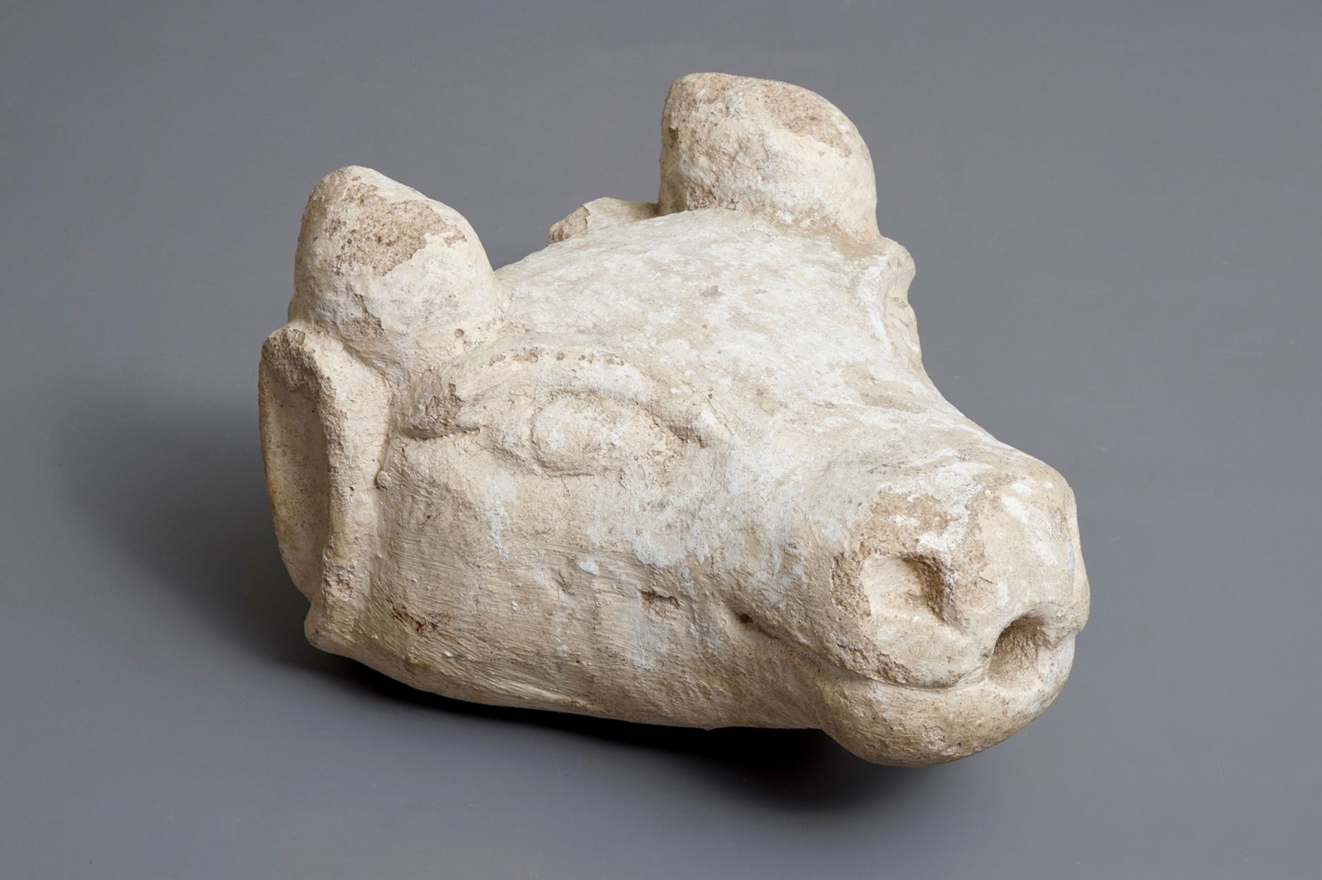 A carved stone fountain head in the shape of a buffalo, 17/18th C.