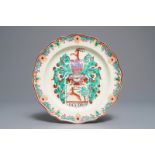 A Dutch-decorated English creamware armorial plate, 18th C.