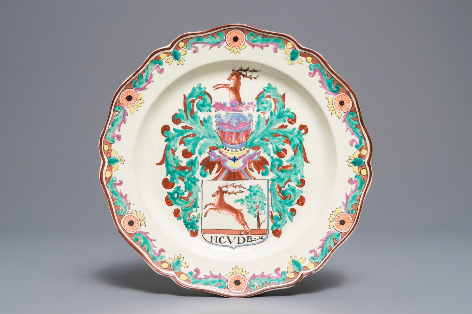 A Dutch-decorated English creamware armorial plate, 18th C.