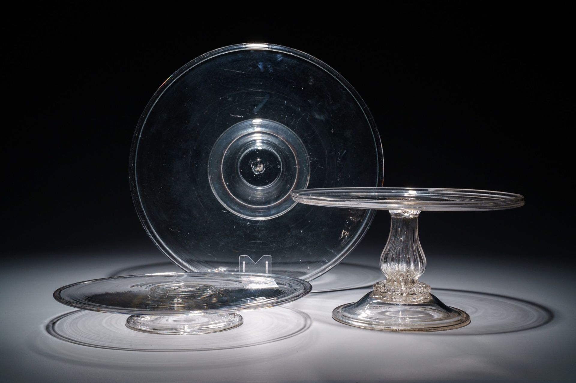 Two glass tazza's on low foot and one taller model, England, 17/19th C.