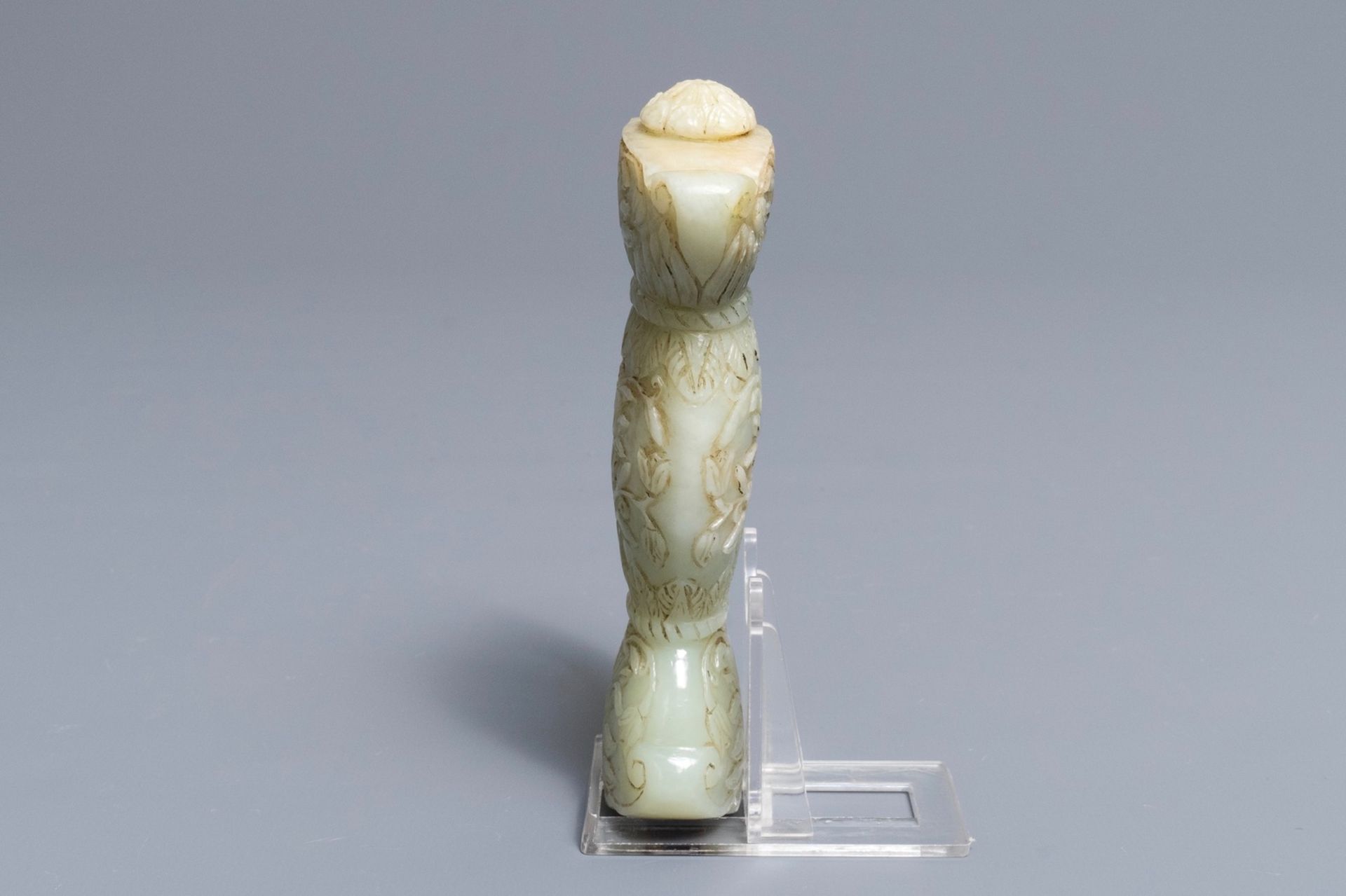 A Mughal-style carved celadon jade sword hilt, India, 19/20th C. - Image 3 of 6