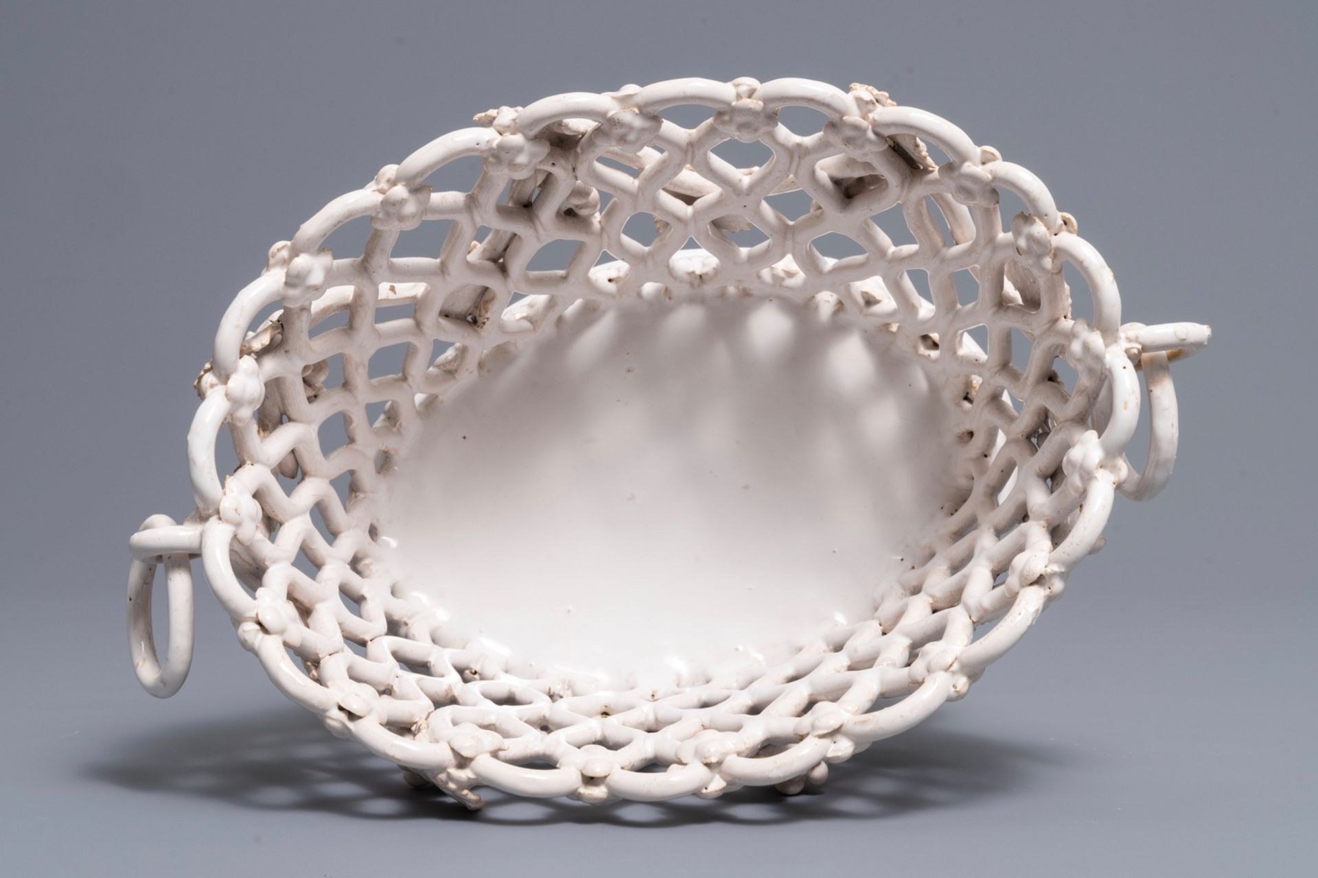 A white-glazed reticulated 'grape vines' basket, France or Italy, 19th C. - Image 6 of 7
