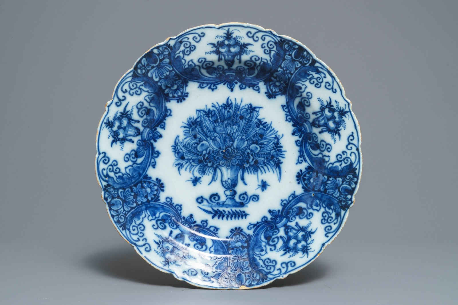 Two Dutch Delft blue and white chargers, an oval dish and a vase, 18th C. - Image 2 of 13