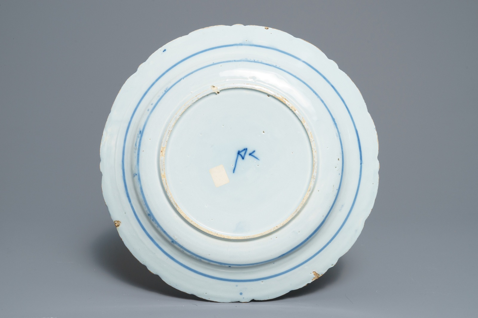 Two Dutch Delft blue and white chargers, an oval dish and a vase, 18th C. - Image 3 of 13