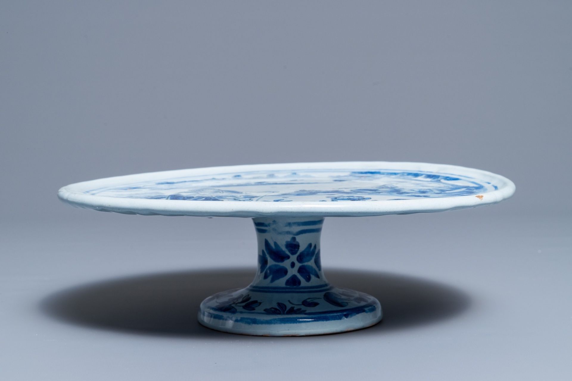 A blue and white French faience tazza with a galant scene, Nevers, late 17th C. - Image 3 of 3
