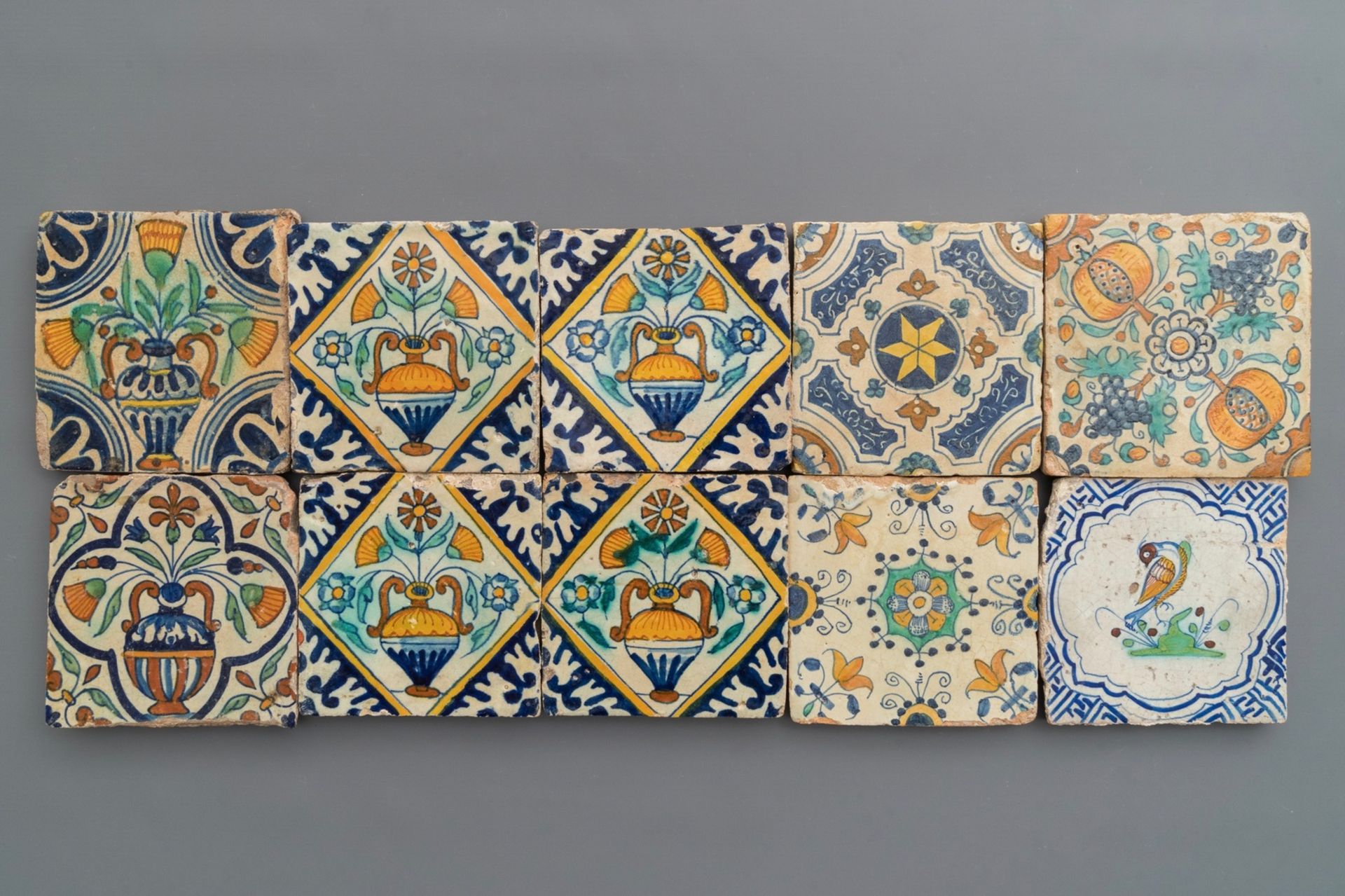 Ten polychrome Dutch Delft tiles with various designs, 16/17th C.