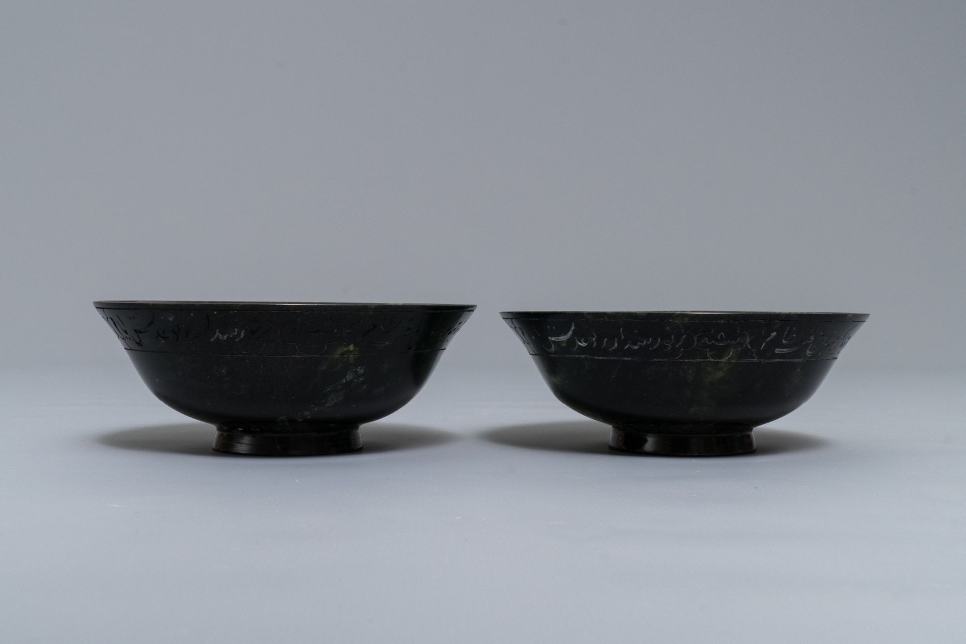 A pair of dark spinach green jade bowls with Arabic or Urdu inscriptions, India, 19/20th C. - Image 5 of 7