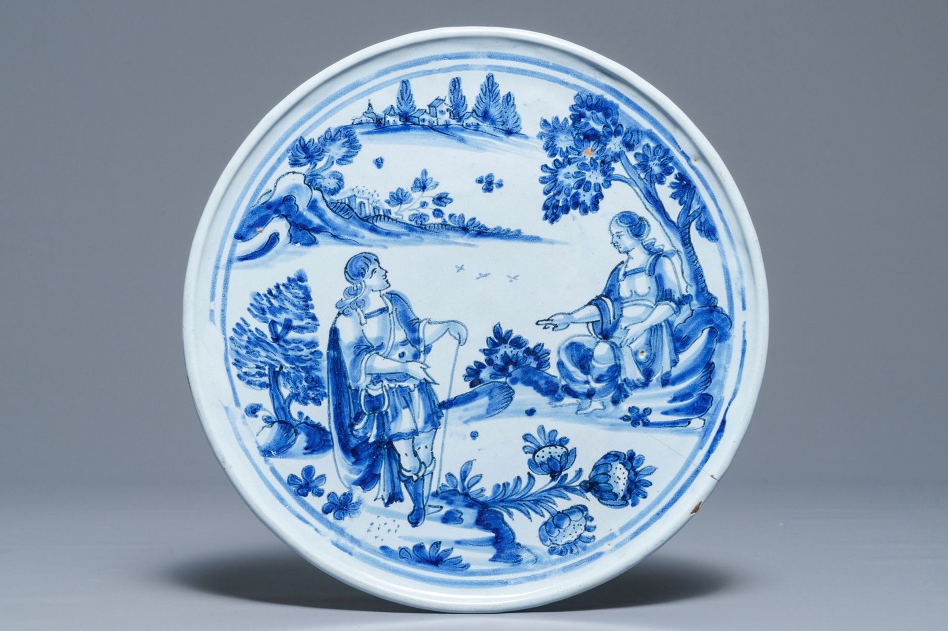 A blue and white French faience tazza with a galant scene, Nevers, late 17th C.