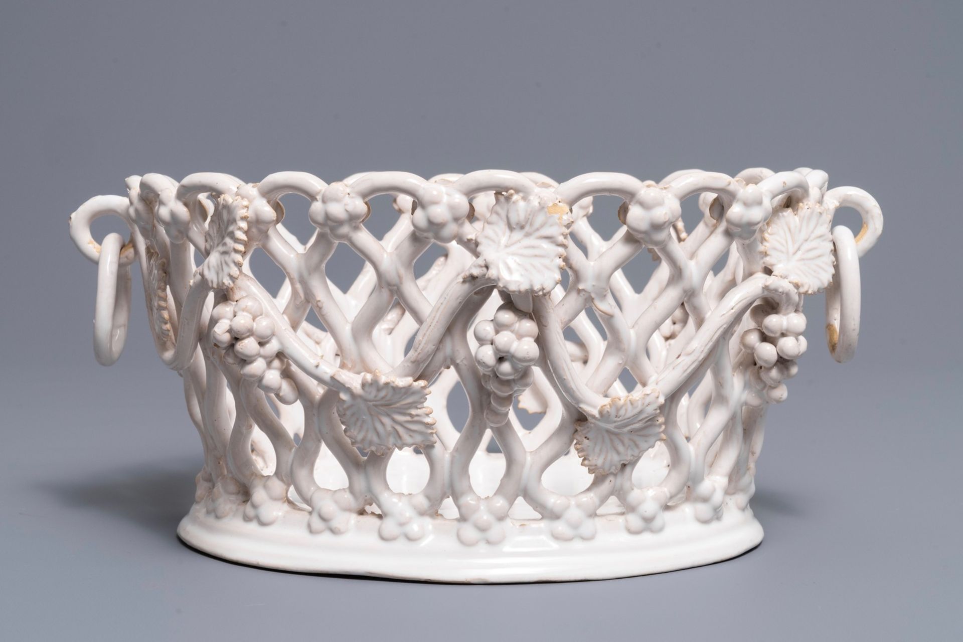 A white-glazed reticulated 'grape vines' basket, France or Italy, 19th C. - Image 2 of 7