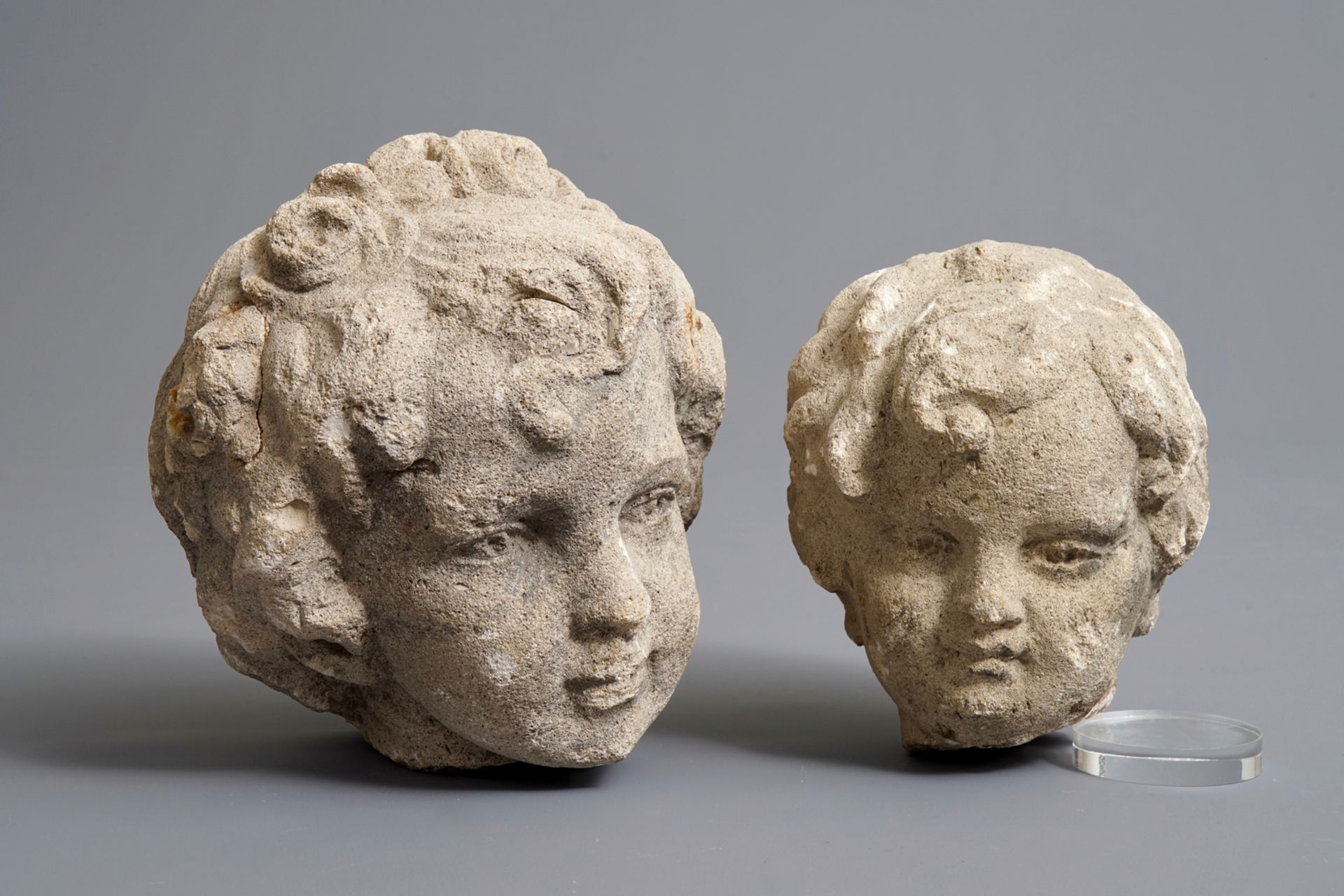 Two carved stone cherub's heads, poss. France, 17th C.