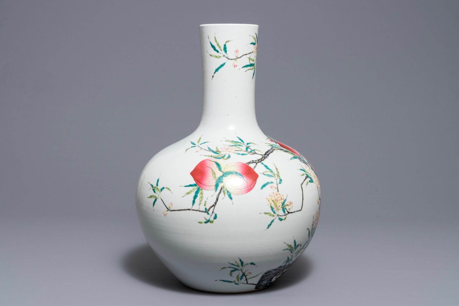 A Chinese famille rose Ônine peachesÕ tianqiu ping vase, Qianlong mark, 20th C.
