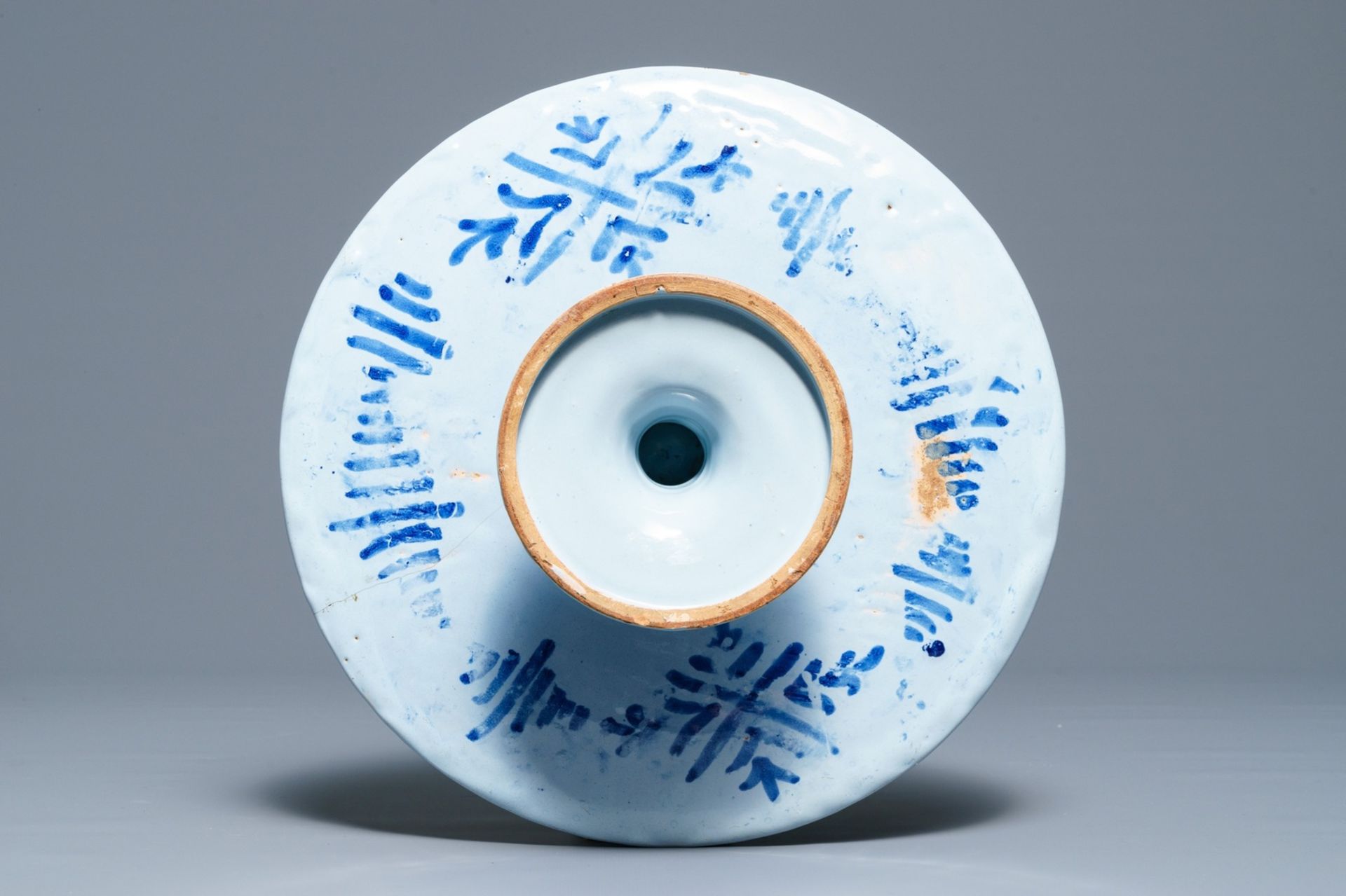 A blue and white French faience tazza with a galant scene, Nevers, late 17th C. - Image 2 of 3