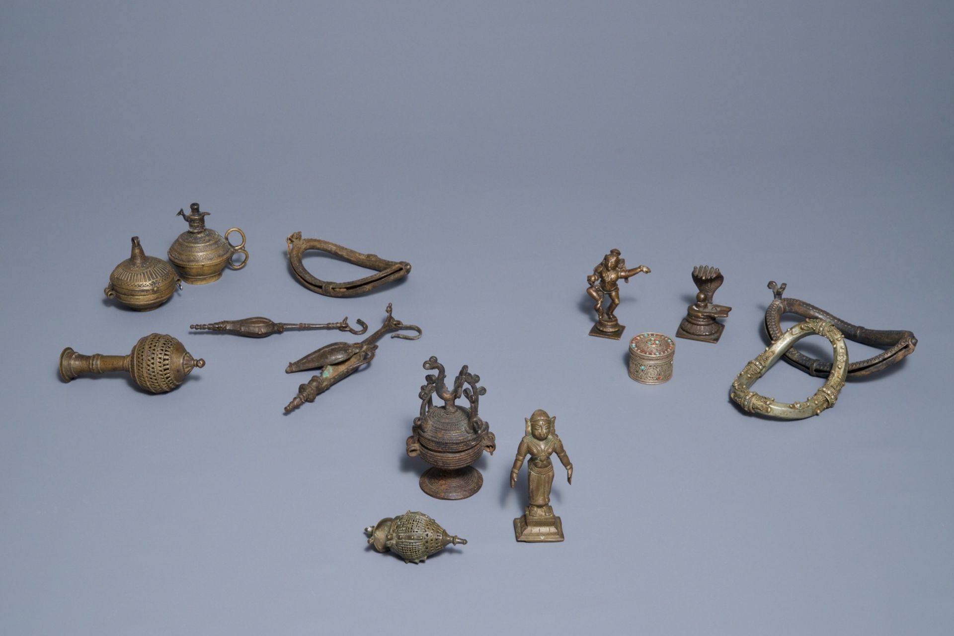 A group of silver and bronze statues and utensils, India, 18/19th C.