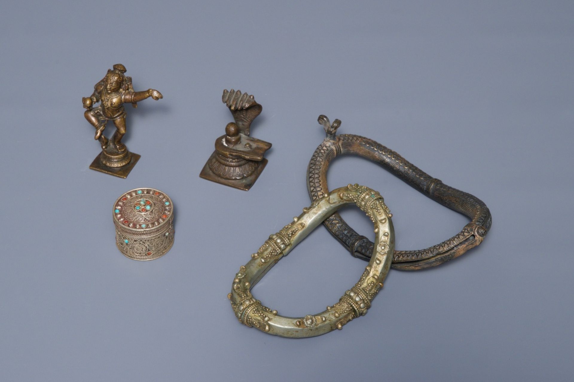 A group of silver and bronze statues and utensils, India, 18/19th C. - Image 3 of 4