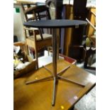 A small chrome leg & column black top circular side table