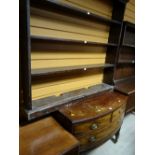 An antique mahogany bow-fronted compact chest with two-short above one-long drawer on raised