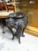 A Chinese carved hardwood planter stand