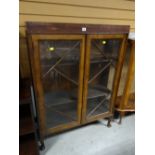 A vintage dark wood Deco-style two glass door display cabinet