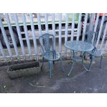 A painted green metal three-piece patio table & chairs set together with a garden trough (outside)