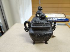 A Chinese bronze temple dog handled censer