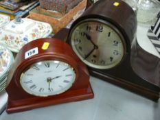 Polished mantel clock and a modern mantel clock