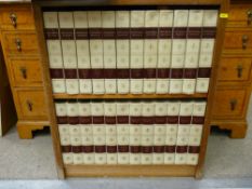 Mahogany bookcase containing a twenty four volume set of Encyclopaedia Britannica plus World Atlas