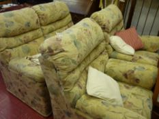 Foliage pattern three piece suite comprising two seater sofa and two armchairs