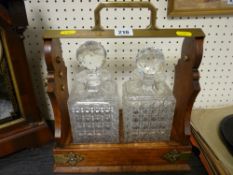 Two bottle tantalus with hobnail decanters and stoppers