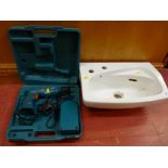 Small vanity sink and a Makita cordless drill E/T