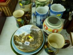 Quantity of collector's wall plates, a collection of colourful jugs etc