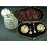 Neat little set of hallmarked silver salts and spoons and a silver topped glass scent bottle