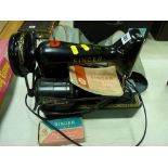 Small electrified Singer 99K sewing machine with accessories, handbook etc E/T