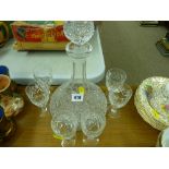 Glass ship's decanter with stopper along with a set of six small drinking glassware