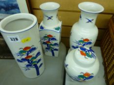 Three colourful vases and a ginger jar and cover with Oriental decoration and backstamp