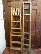 Vintage set of wooden extending ladders and a set of folding wooden steps