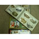 Collection of vintage postcards contained in three albums and a sleeved collection of first day