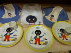 Three golly decorative plates, two eggcups and a T-shirt and two baseball caps