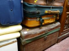 Vintage tin travel trunk and a quantity of modern luggage
