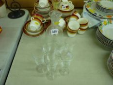 Bell form decanter and stopper along with seven stem glasses, all with swirl decoration
