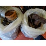 Two plastic bags of roof guttering, plastic fitments and accessories