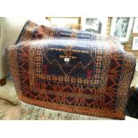 A small Indian woollen blue & rust patterned rug