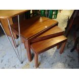 A nest of three teak wood tables by Gordon Russell