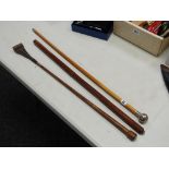 Three swagger sticks, one with a hallmarked silver Welch Regiment finial & inscribed Major Cutler