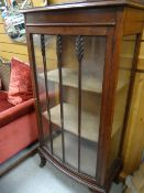 A neat vintage bow fronted glass display cabinet
