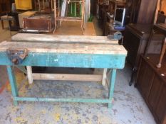 A workshop bench with two vices