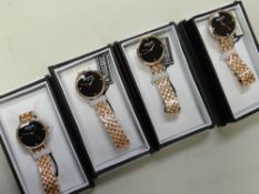 Four Barkers of Kensington 'Regatta' black faced ladies wristwatches