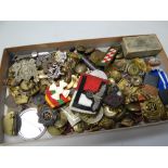 A parcel of various military badges, buttons etc