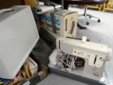 Vintage boxed Panasonic electronic typewriter together with a cased Singer 457 electric sewing