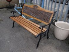A black metal ended & slatted garden bench (outside)